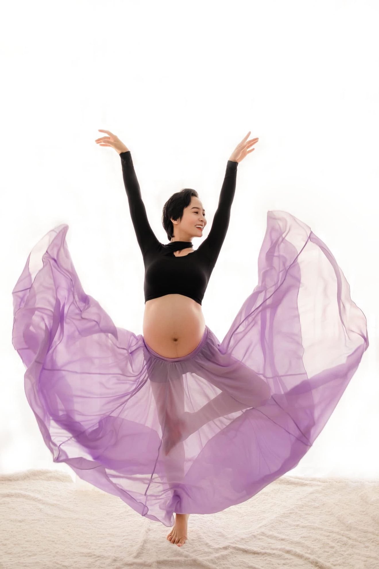 Xuan pregnant with Rosie — flowing purple dress